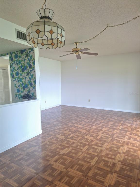 580 Fairways Circle, Unit A Ocala, FL 34472 - Photo 9 of 15 a view of a big room with a chandelier fan