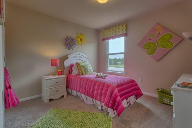1009 Limpkin Street Crestview, FL 32539 - Photo 13 of 21 a bedroom with a bed and a window