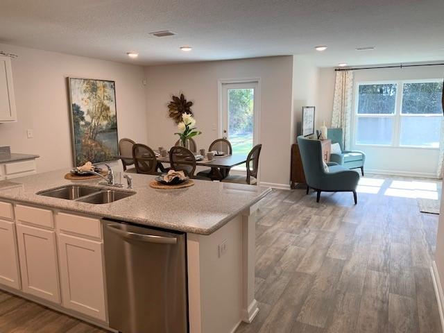 1009 Limpkin Street Crestview, FL 32539 - Photo 3 of 21 a kitchen with a sink cabinets and wooden floor
