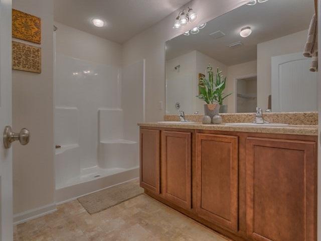 1009 Limpkin Street Crestview, FL 32539 - Photo 10 of 21 a bathroom with a sink and a mirror
