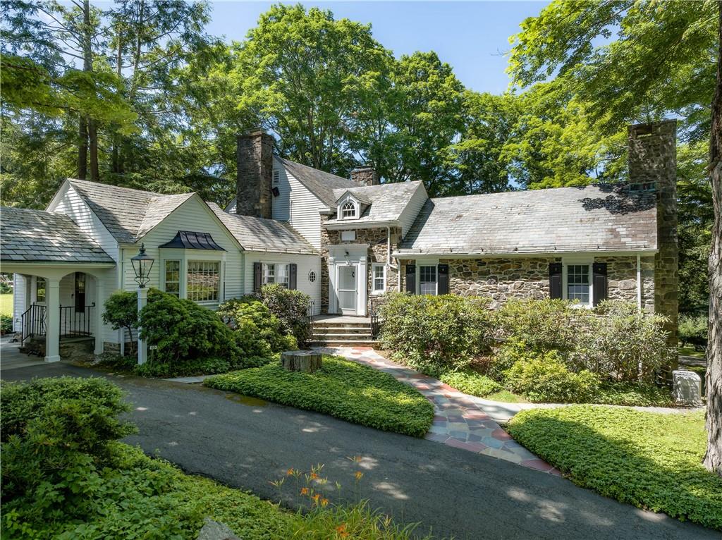 a aerial view of a house with a yard and potted plants