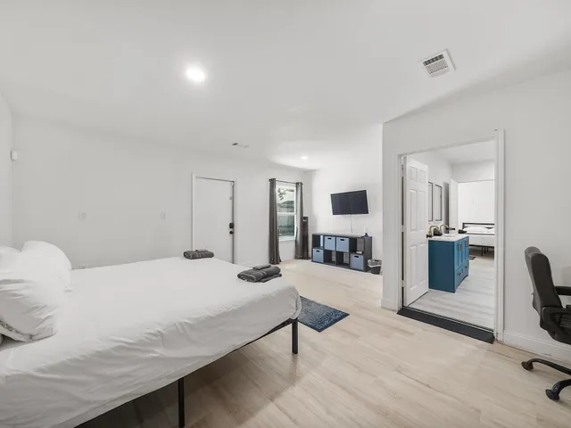 a bedroom with a bed and furniture