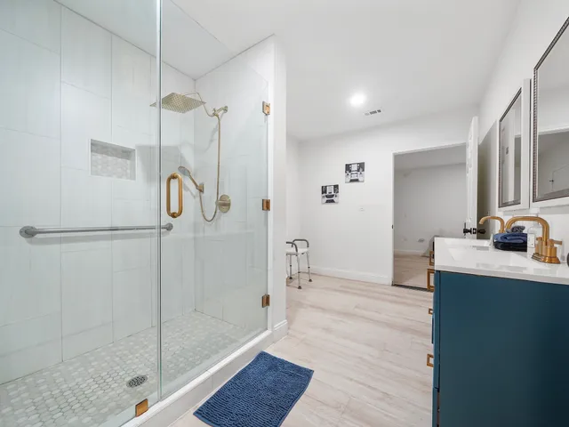 a bathroom with a shower and a sink