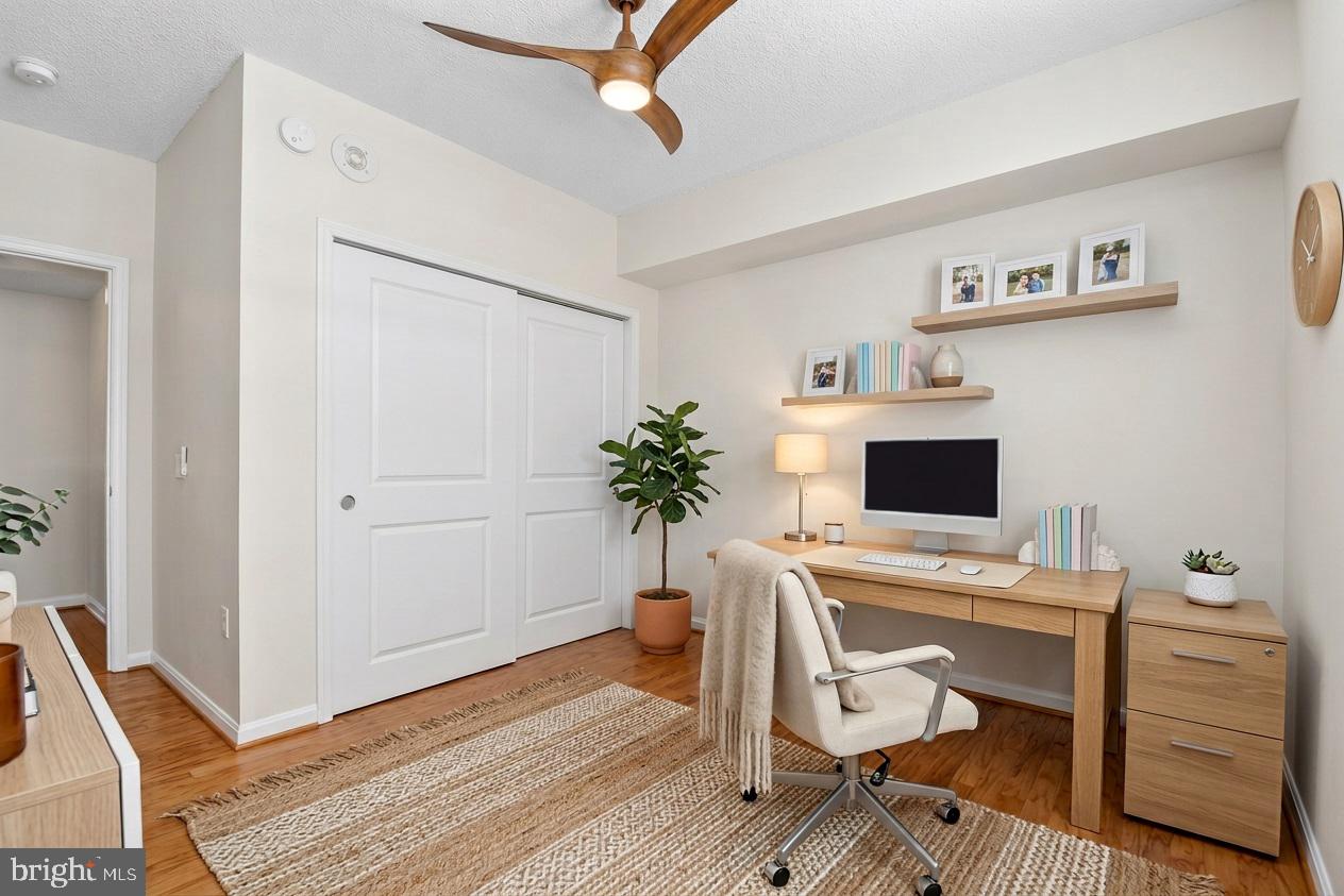 930 Wayne Avenue, Unit 405 Silver Spring, MD 20910 - Photo 25 of 68 a view of a workspace with furniture and a window