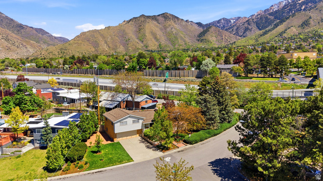 4245 3320 East Holladay, UT 84124 - Photo 47 of 51 Property featuring a paved driveway, attached garage, and mature landscaping