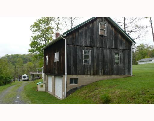 270 Spiker Road Cabot, PA 16023 - Photo 5 of 8 Parking Lot/Garage. Full two car detached garage on the bottom; a full wood working shop on the middle floor; and a hay loft up top. Garage has separate 150 amp service, furnace, and office