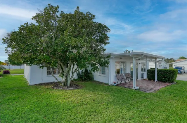an aerial view of a houses with outdoor space