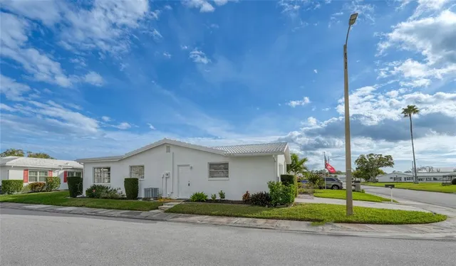 an aerial view of house with yard