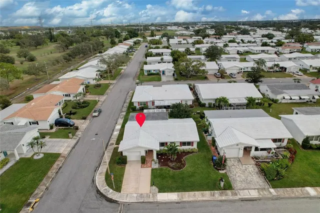 an aerial view of a houses with outdoor space