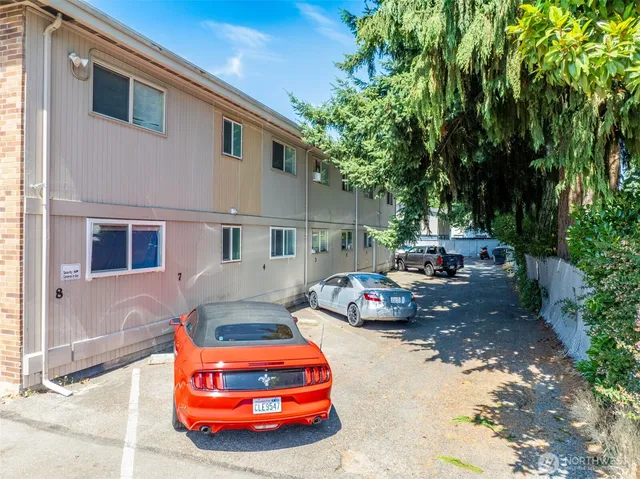 a front view of a house with parking space