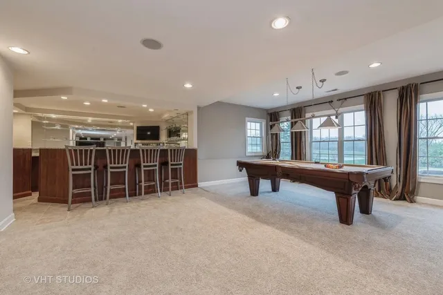 a room with lots of furniture and a large window