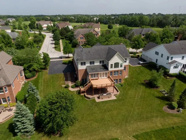 an aerial view of a house with a garden