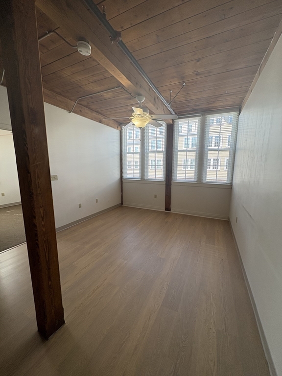 7 Marble Street, Unit 206E Whitman, MA 02382 - Photo 2 of 6 an empty room with windows