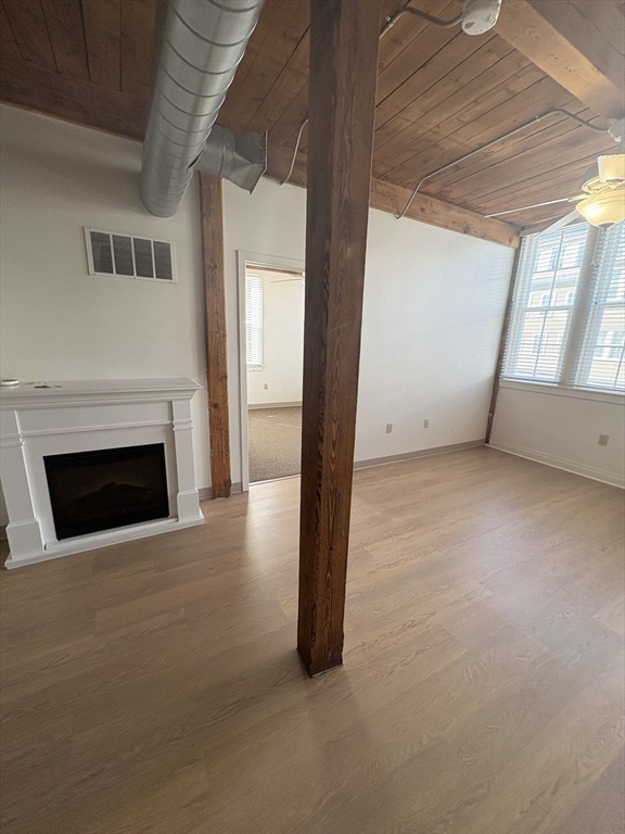 7 Marble Street, Unit 206E Whitman, MA 02382 - Photo 3 of 6 a view of empty room with a fireplace