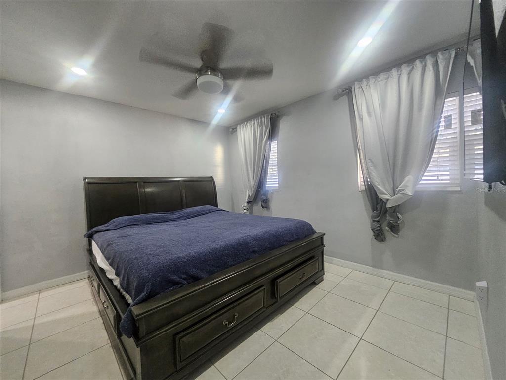 802 Windsor Circle Brandon, FL 33510 - Photo 12 of 17 a bedroom with a bed and a window