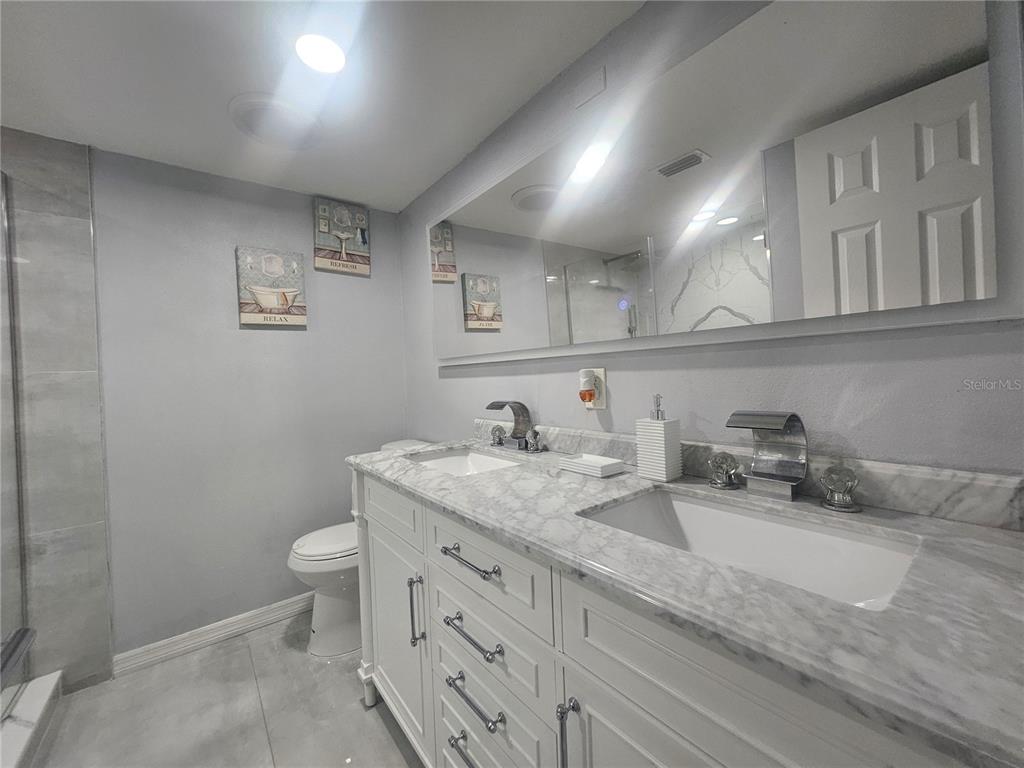 802 Windsor Circle Brandon, FL 33510 - Photo 15 of 17 a bathroom with a granite countertop sink and a toilet