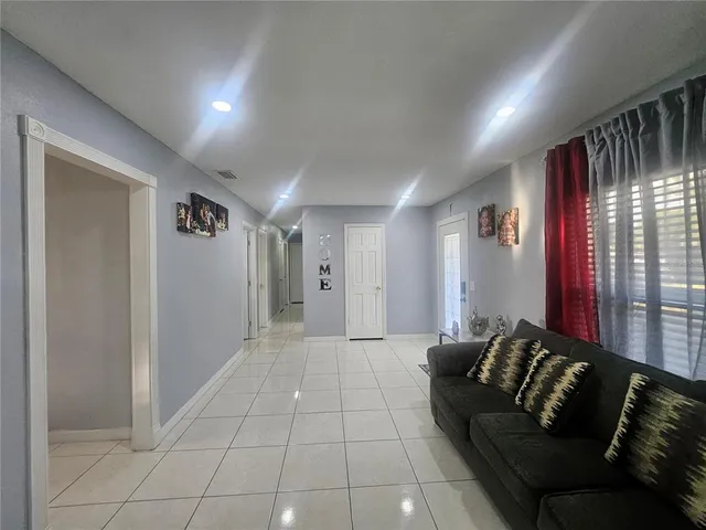 a living room with furniture and a rug
