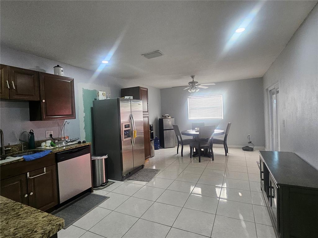 802 Windsor Circle Brandon, FL 33510 - Photo 10 of 17 a kitchen with a cabinets and chairs