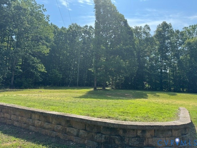 1927 Five Forks Road Pamplin, VA 23958 - Photo 3 of 42 Expansive green lawn framed by a stone retaining w