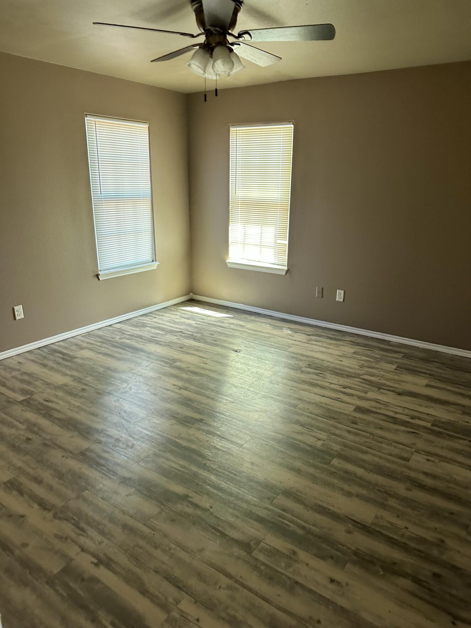 118 81st Street, Unit 1 Lubbock, TX 79404 - Photo 2 of 10 a view of an empty room with a window