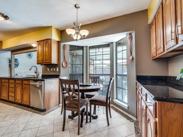a living room with fireplace furniture and a flat screen tv