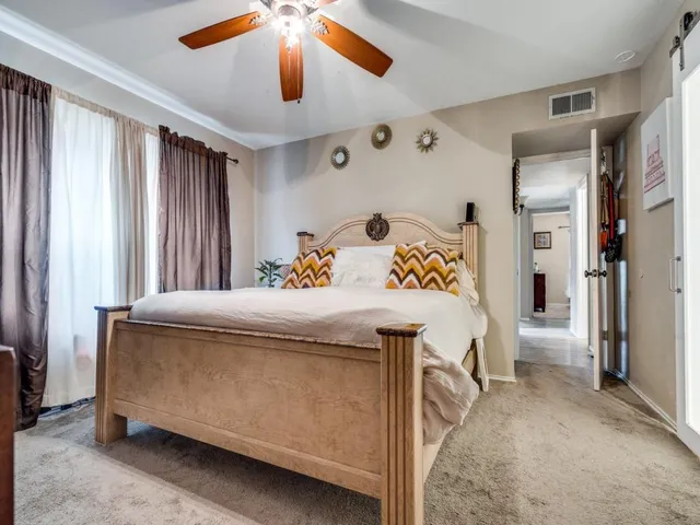 a living room with furniture and chandelier