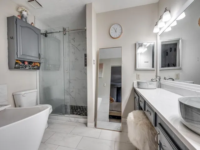 a view of a workspace with furniture and a potted plant