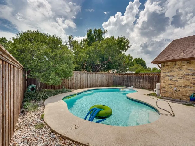 a bathroom with a sink mirror vanity and toilet