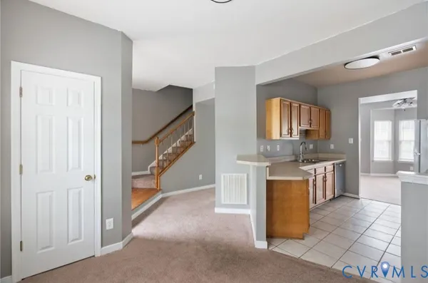 a kitchen with stainless steel appliances granite countertop a sink and a stove