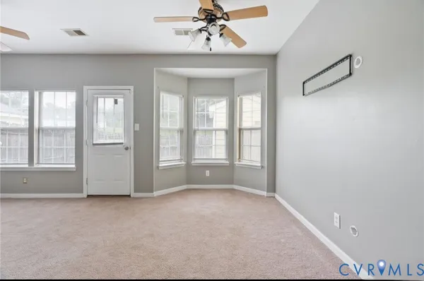 a view of an empty room with a window