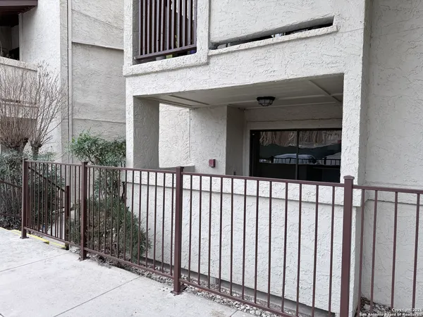 a view of a house with a gate