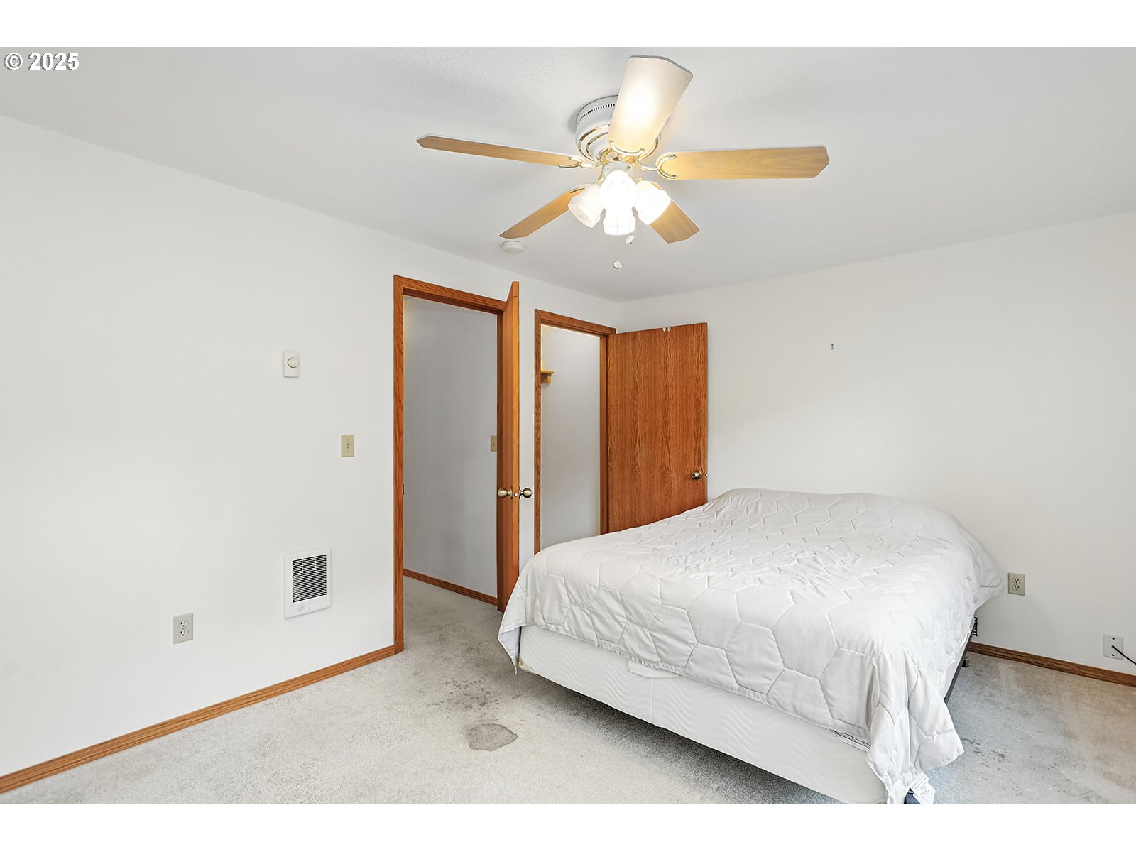 850 Highway 142 Lyle, WA 98635 - Photo 12 of 39 a bedroom with a bed and a chandelier