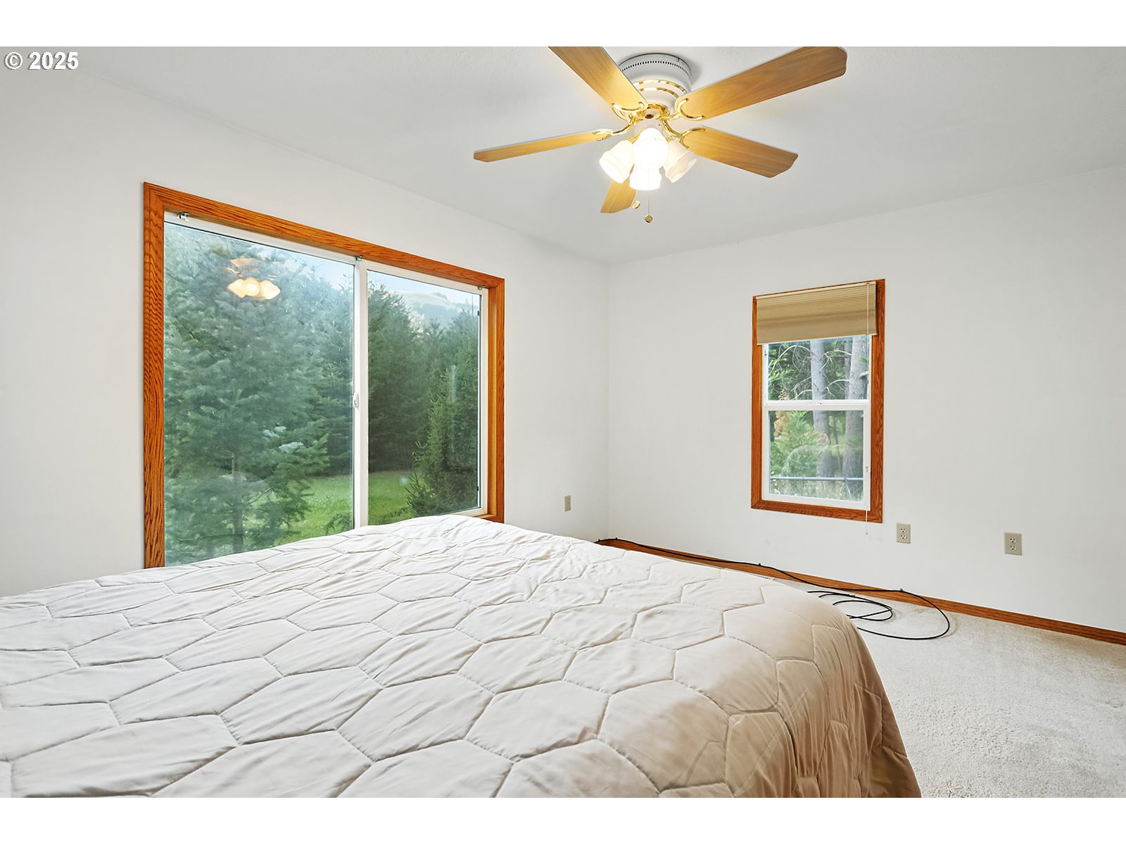 850 Highway 142 Lyle, WA 98635 - Photo 13 of 39 a bedroom with a large bed and a large window