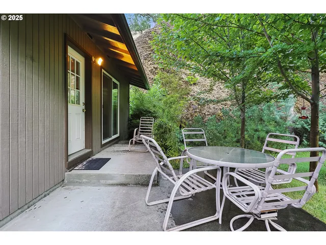 a backyard of a house with seating space