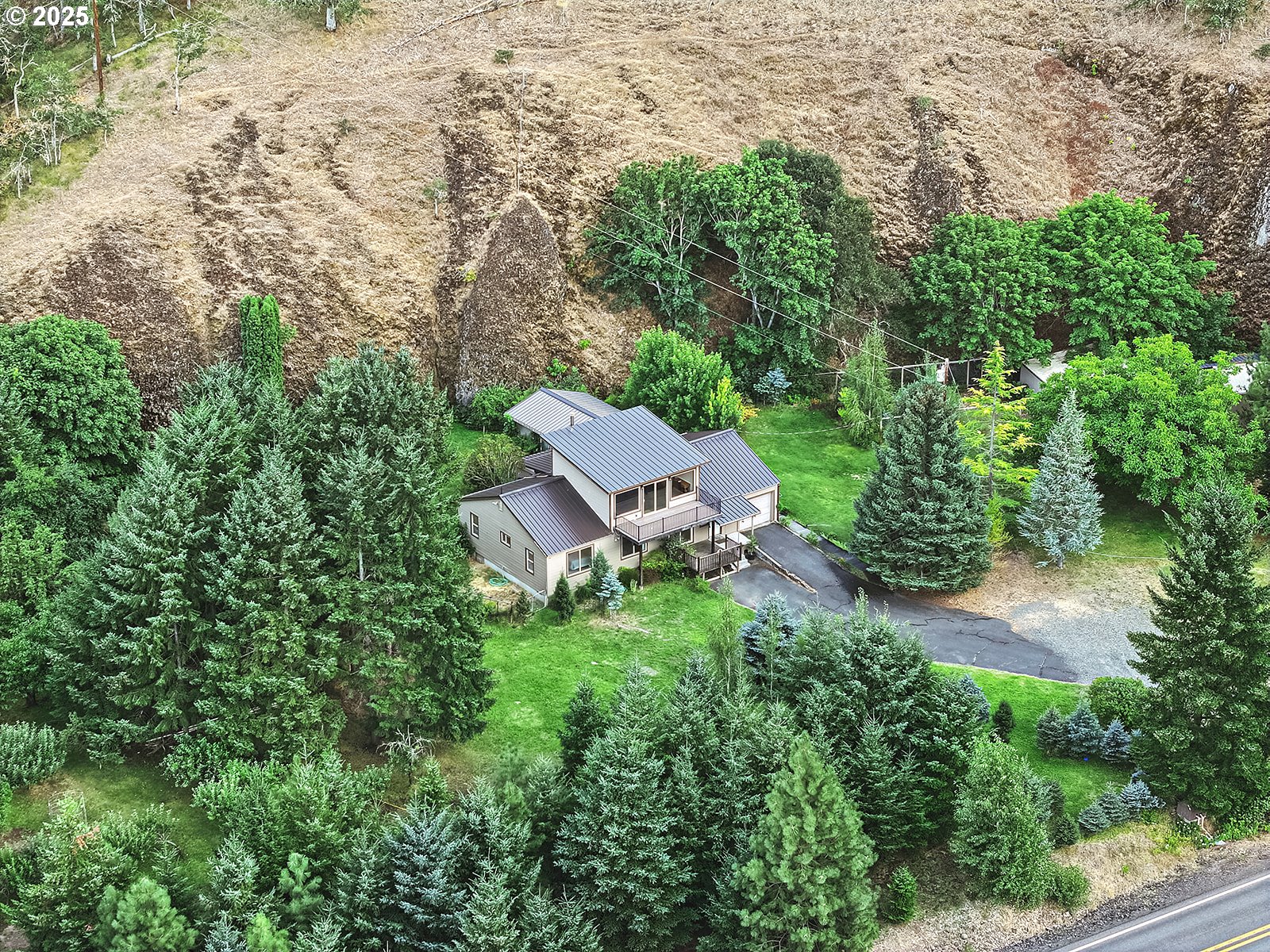 850 Highway 142 Lyle, WA 98635 - Photo 26 of 39 an aerial view of a house with yard and outdoor seating