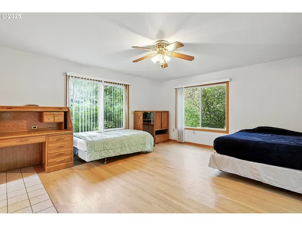 a living room with stainless steel appliances kitchen island granite countertop furniture and a large window