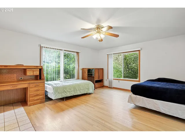 a living room with stainless steel appliances kitchen island granite countertop furniture and a large window