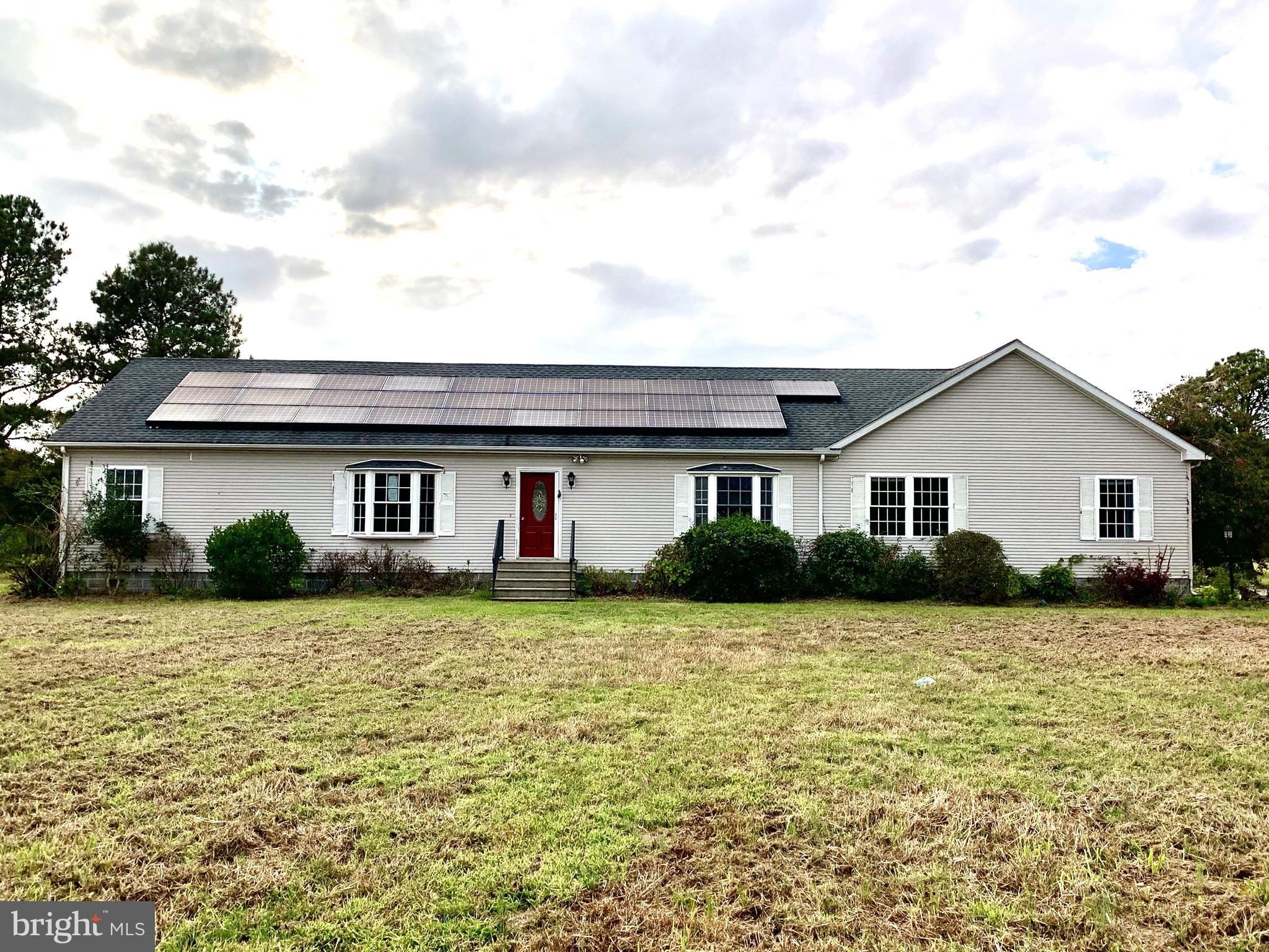 a front view of a house with yard
