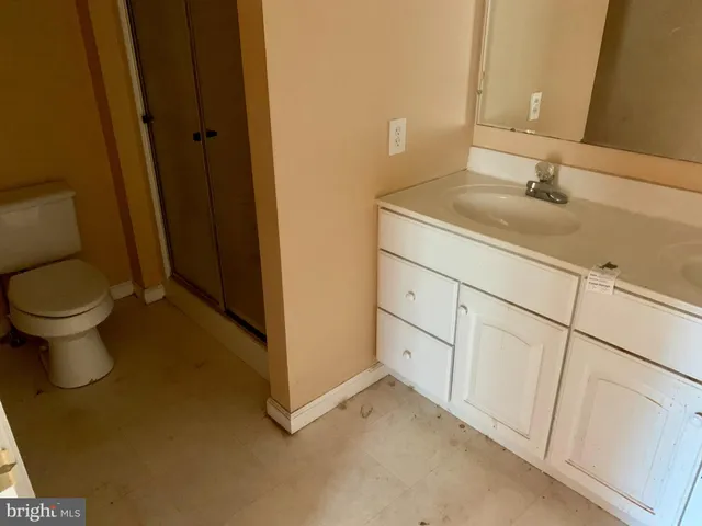 a bathroom with a sink and toilet