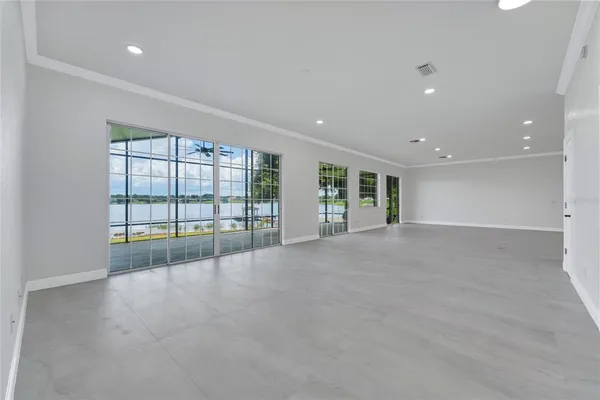 a large kitchen with stainless steel appliances kitchen island a large counter space a sink and cabinets
