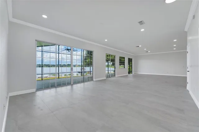 a large kitchen with stainless steel appliances kitchen island a large counter space a sink and cabinets