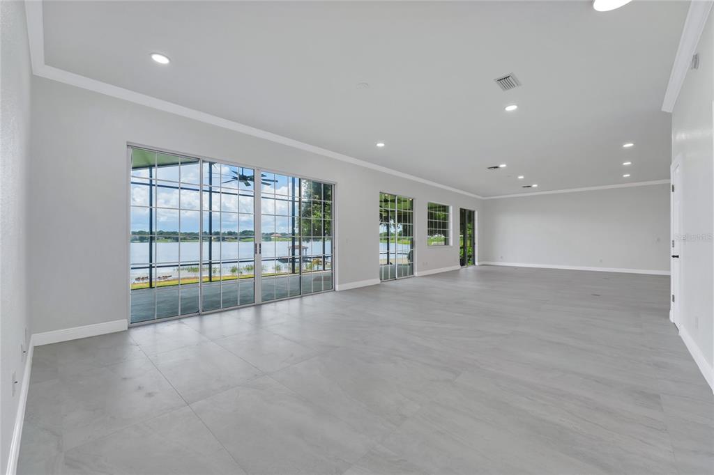 1703 Roberts Landing Road Windermere, FL 34786 - Photo 11 of 61 a view of an empty room with a sliding door
