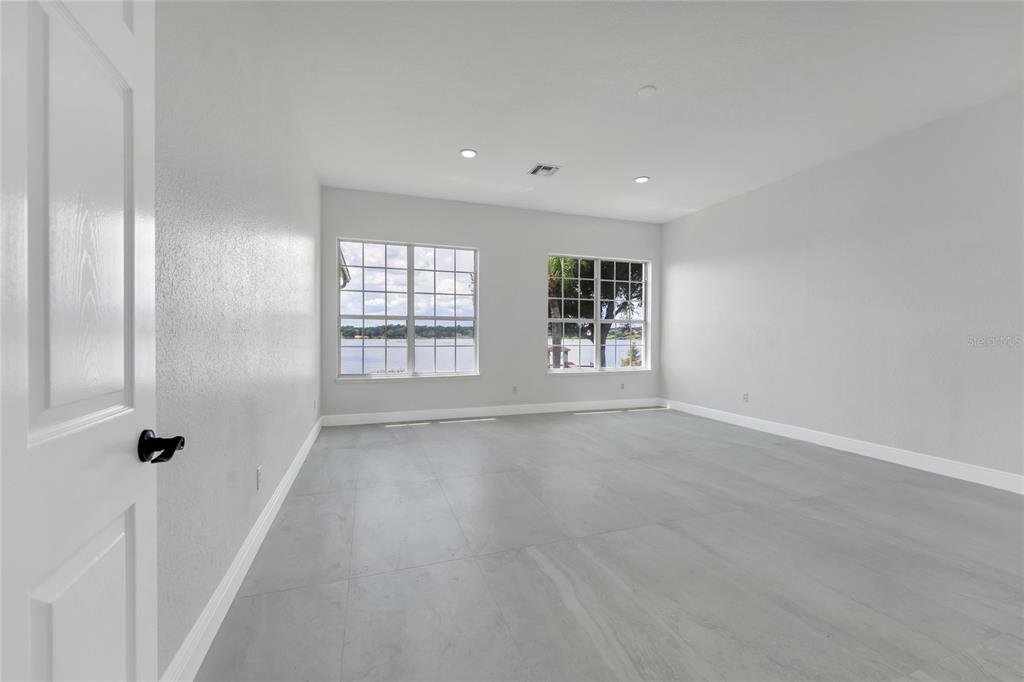 1703 Roberts Landing Road Windermere, FL 34786 - Photo 25 of 61 wooden floor in an empty room with a window