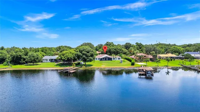 a kitchen with kitchen island a sink stainless steel appliances and cabinets