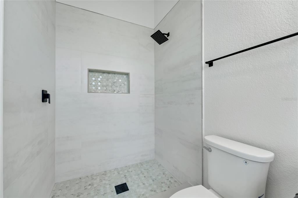 1703 Roberts Landing Road Windermere, FL 34786 - Photo 33 of 61 a bathroom with a shower and a toilet