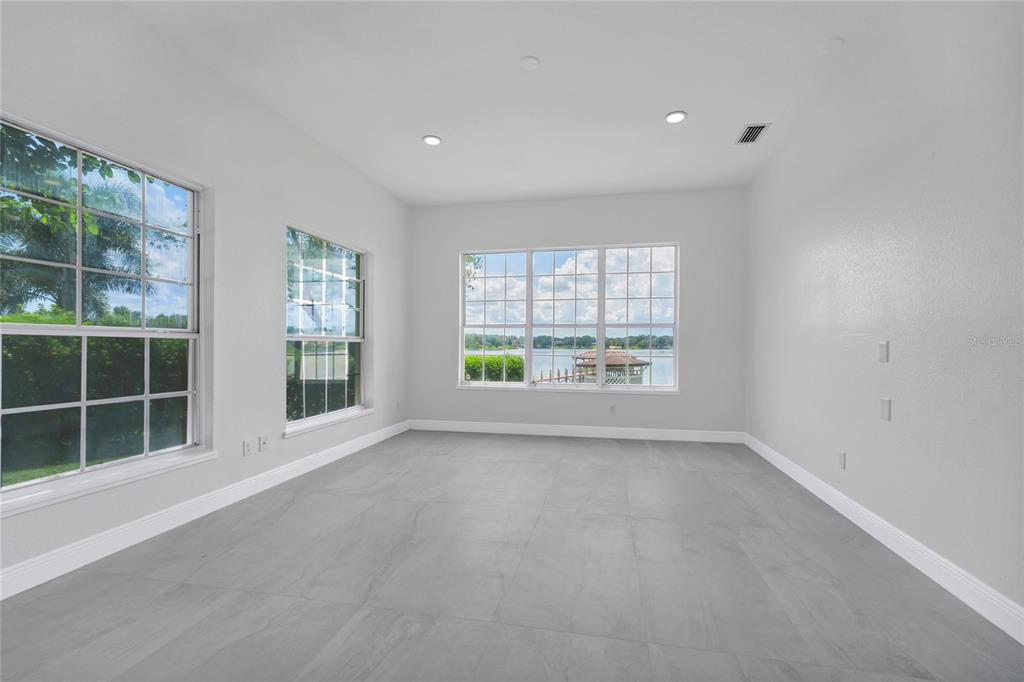1703 Roberts Landing Road Windermere, FL 34786 - Photo 36 of 61 an empty room with windows