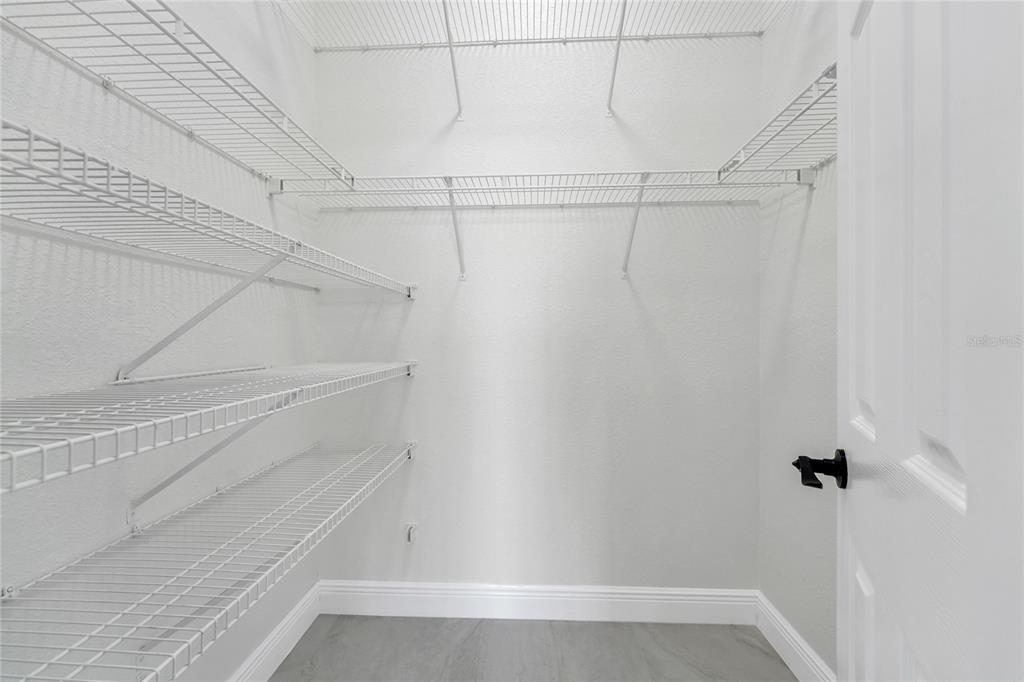 1703 Roberts Landing Road Windermere, FL 34786 - Photo 37 of 61 a view of a room with racks on the wall