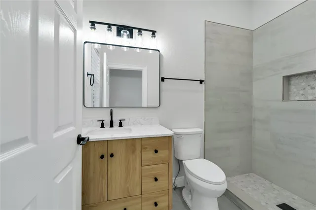 a bathroom with a double vanity sink mirror and