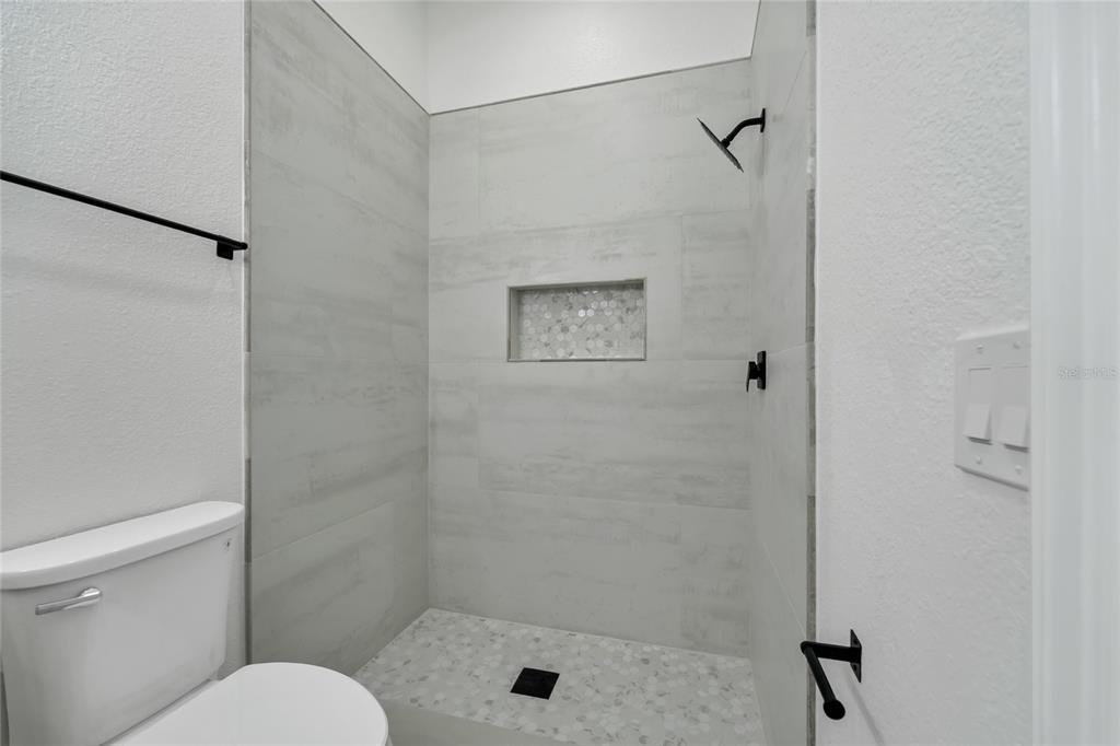 1703 Roberts Landing Road Windermere, FL 34786 - Photo 39 of 61 a bathroom with a shower and a toilet
