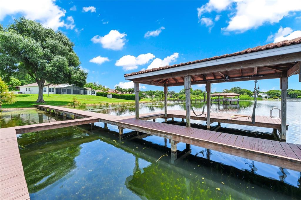 1703 Roberts Landing Road Windermere, FL 34786 - Photo 49 of 61 a porch with swimming pool table and chairs